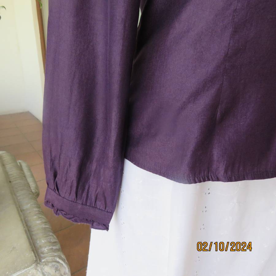 Smart shiny dark purple long sleeve tailored top size 34. V front with banded neckline.As new cond.