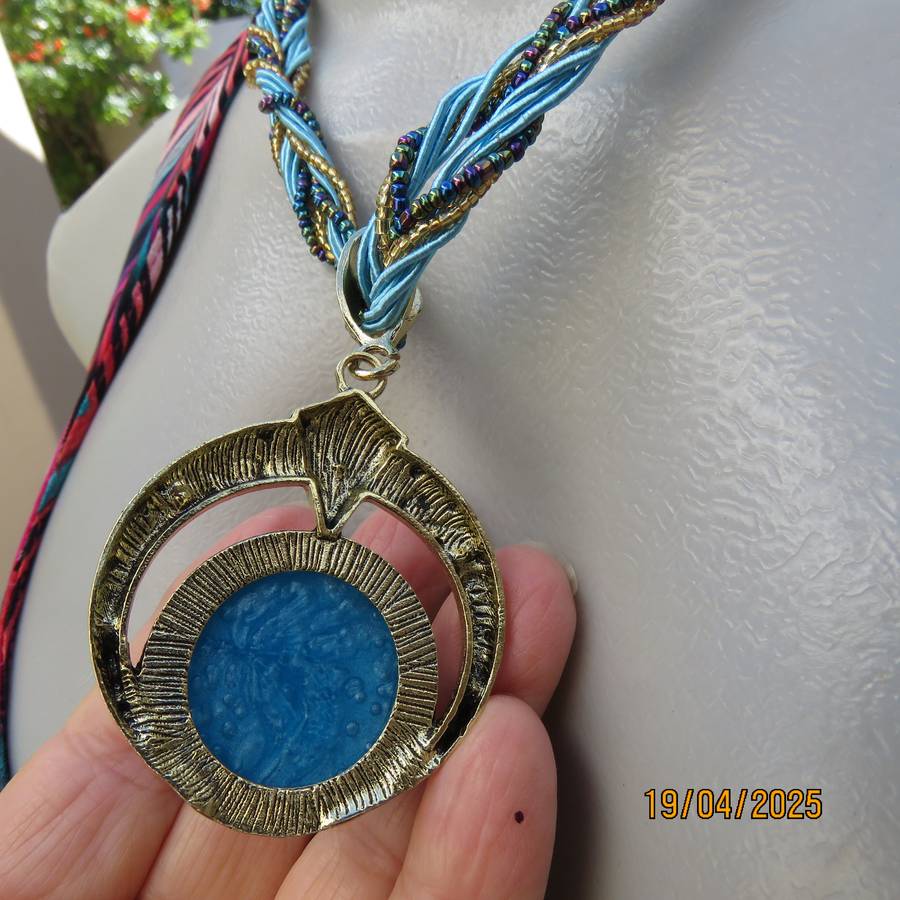 Smart turquoise stone on gold base pendant hang on cord and bead strap. New