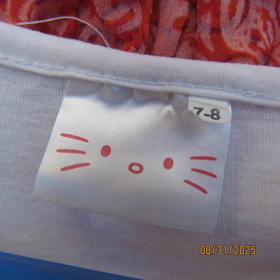 HELLO KITTY cotton dress with white top and white-navy bottom. Girl 7 to 8 yrs.