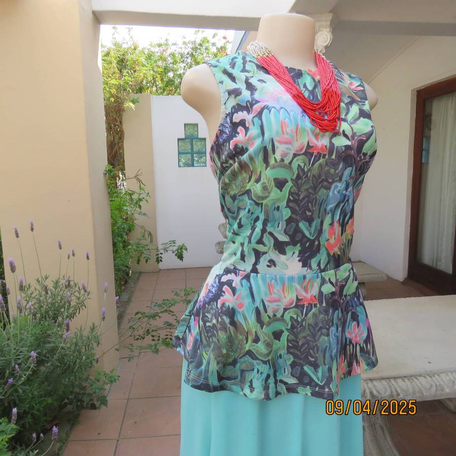 H&M slip over cheerful floral printed sleeves polyester stretch peplum top. Size 38