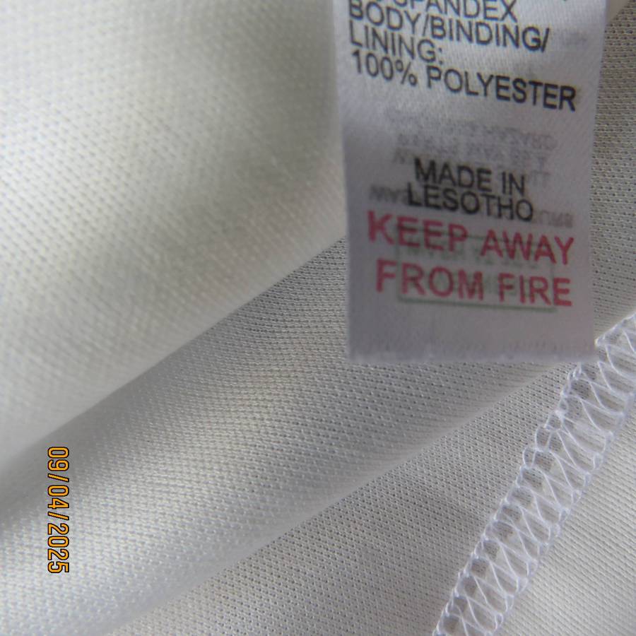 White stretch polyester lace slip over peplum top fully lined. Size 38