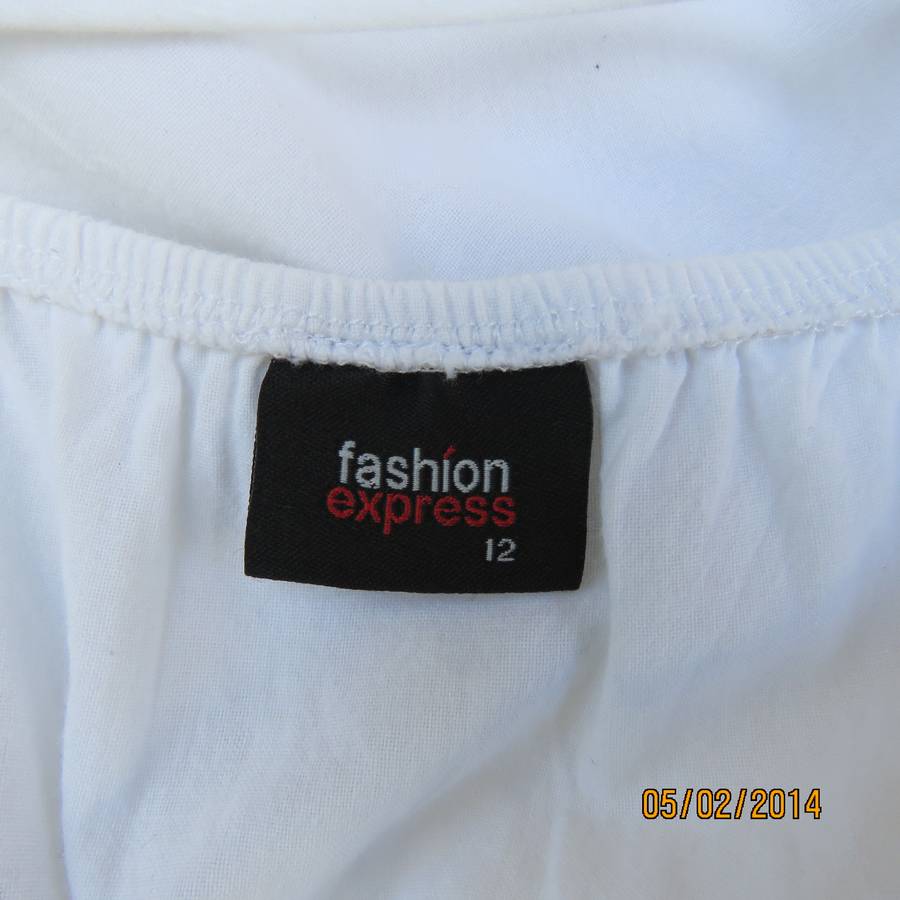 As new white slightly creased 100% cotton strappy dress. Size 36.Elasticated waist.Half flare skirt.