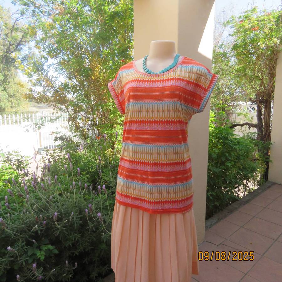 Orange-blue-gold and white horizontal patterned slip over stretch polyester top. Size 36-38