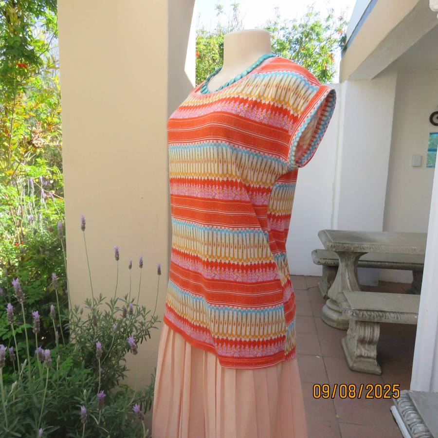 Orange-blue-gold and white horizontal patterned slip over stretch polyester top. Size 36-38