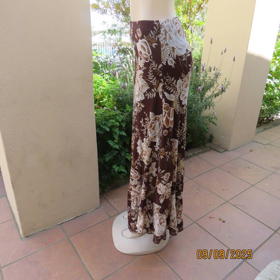 Brown with bold white-beige floral print sheer polyester skirt halfway lined. Size 38