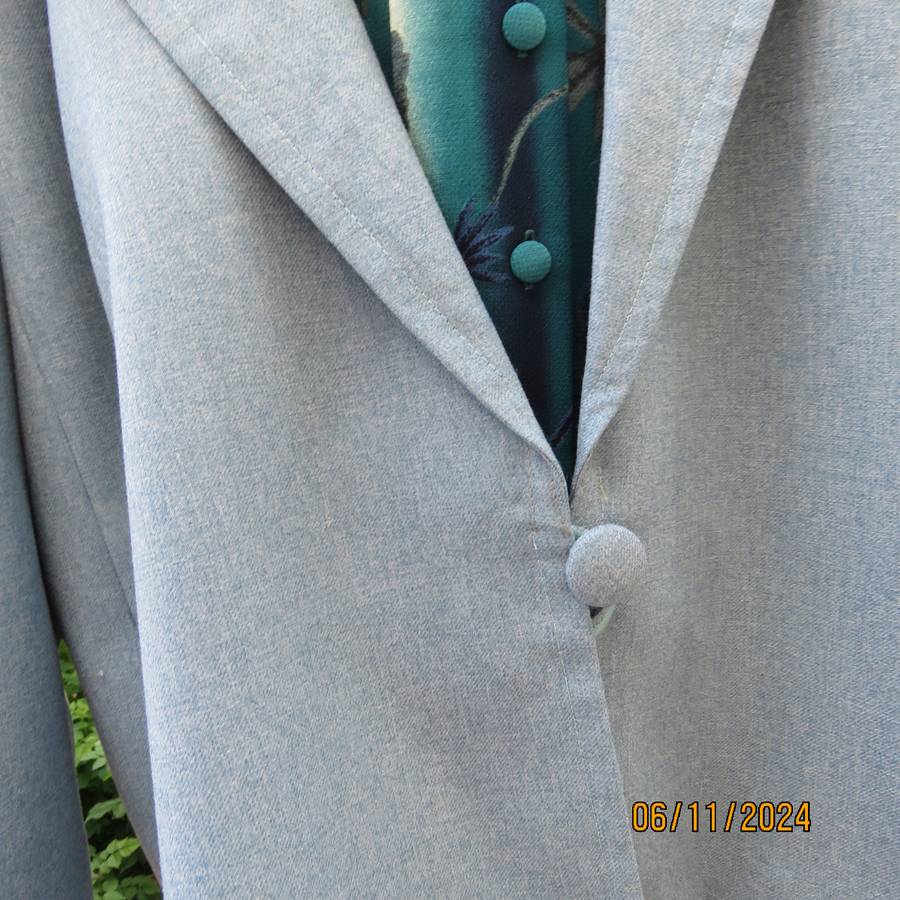 Boutique made light blue polyester-wool blend long sleeve jacket..One button.Size 50