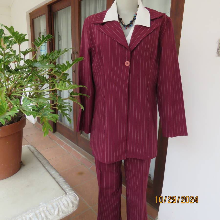 Classic maroon-white pinstripe 2 pc pantsuit. In 100% polyester. Tailored 1 button jacket. Size 40.