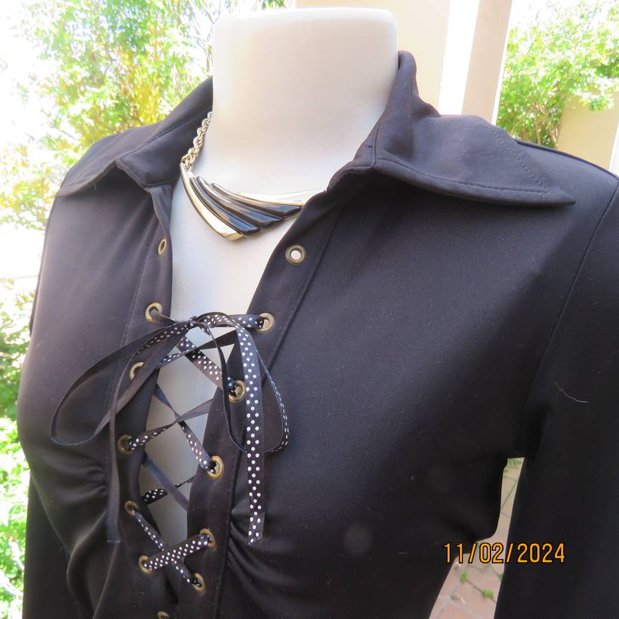 TRUWORTHS black long sleeve stretch polyester size 32 top. With braiding on the front.As new