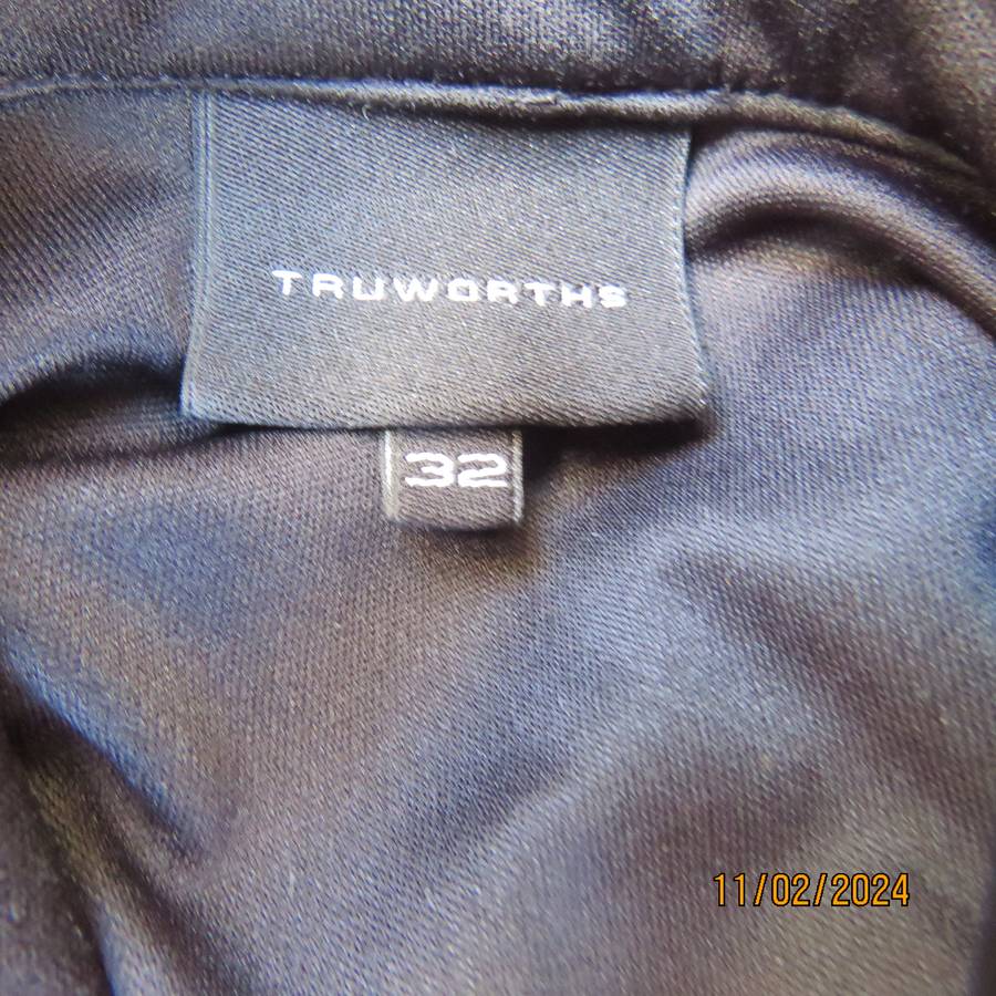 TRUWORTHS black long sleeve stretch polyester size 32 top. With braiding on the front.As new