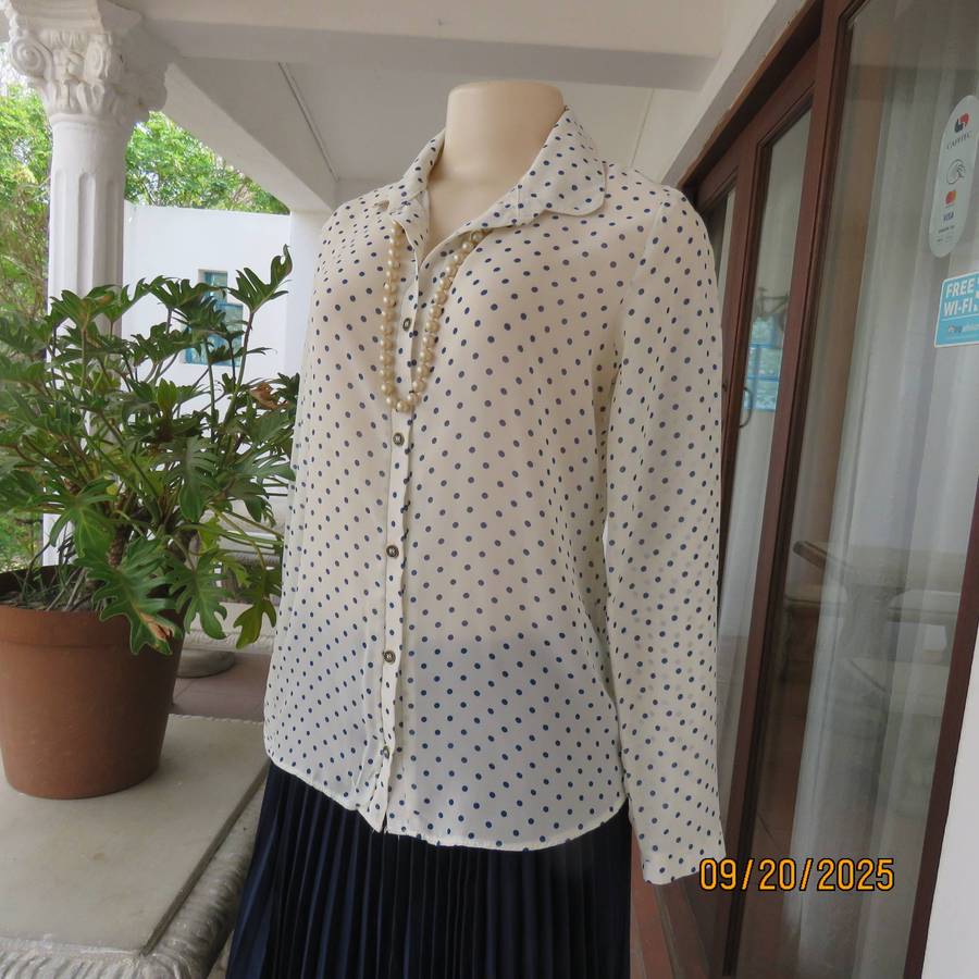 Pastel cream long sleeve polyester blouse with indigo blue dots. Size 32-34
