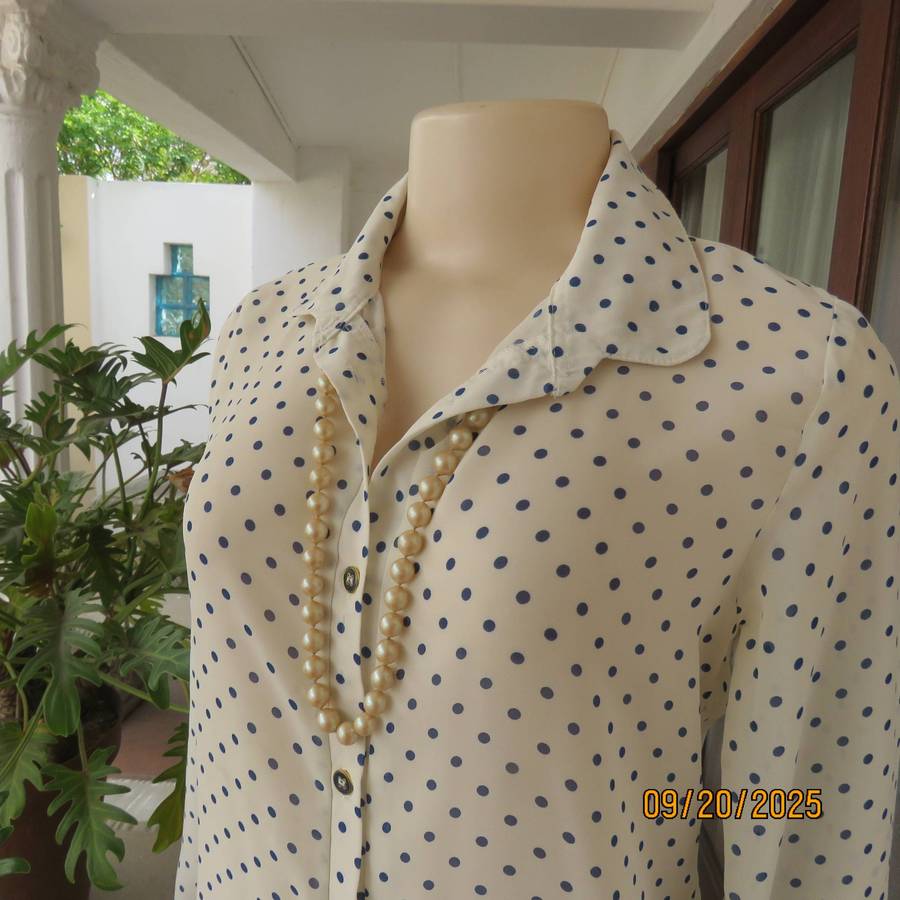 Pastel cream long sleeve polyester blouse with indigo blue dots. Size 32-34