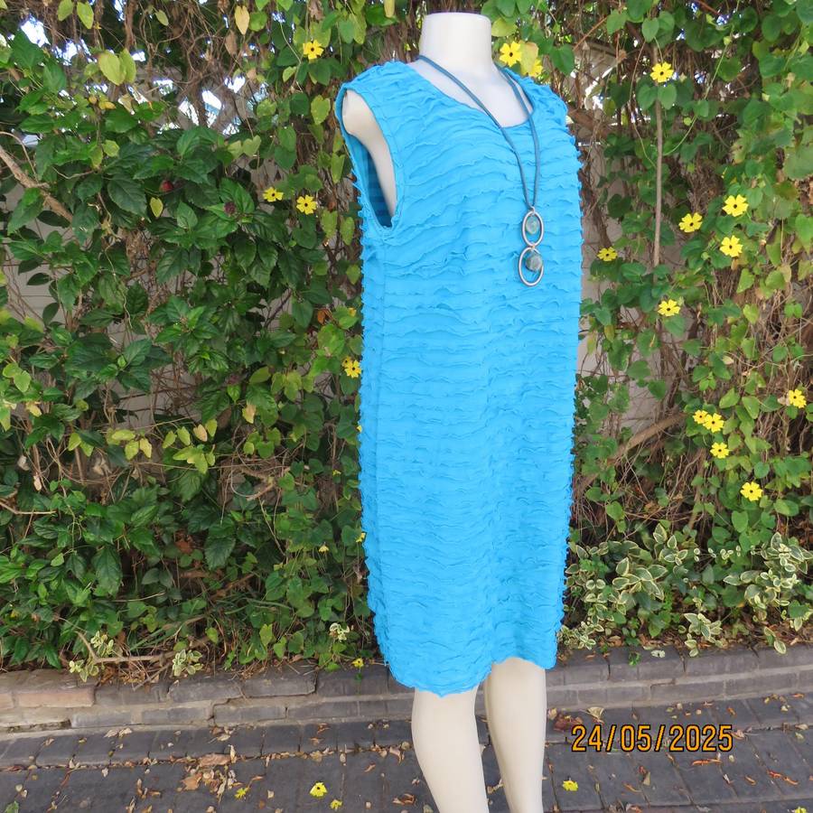 Jade colour sleeveless dress with sheer polyester coat. Boutique made size 40.