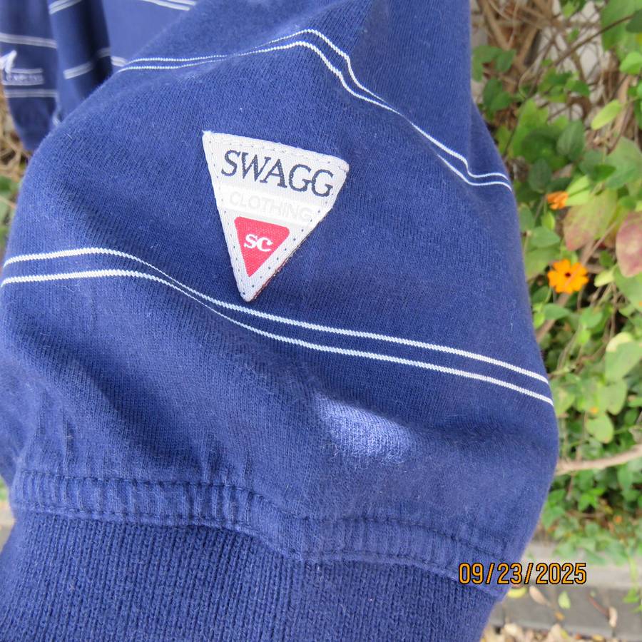 SWAGG navy with thin horizontal white stripe golf short sleeve shirt. Size XL.