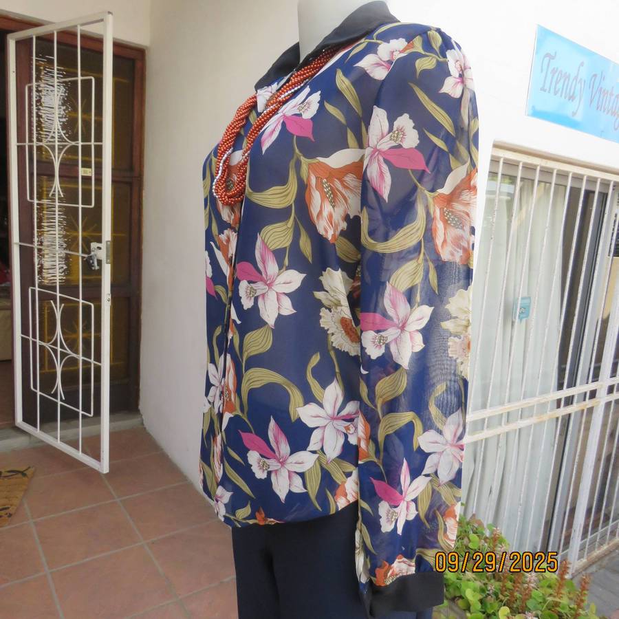 Navy sheer polyester button down top with rust-pink lilies. Black collar-cuffs. Size 36