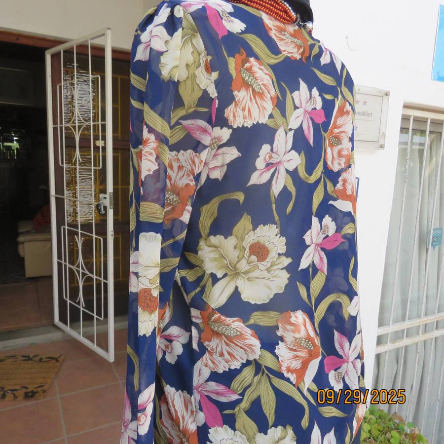 Navy sheer polyester button down top with rust-pink lilies. Black collar-cuffs. Size 36