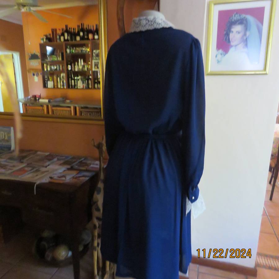 Amazing navy SHUBETTE of LONDON vintage long sleeves sheer polyester dress. Size 36.Lined.Cream lace