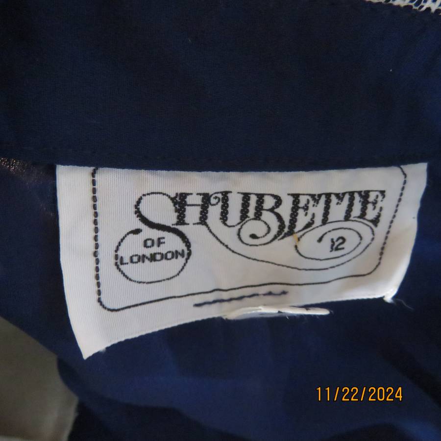 Amazing navy SHUBETTE of LONDON vintage long sleeves sheer polyester dress. Size 36.Lined.Cream lace