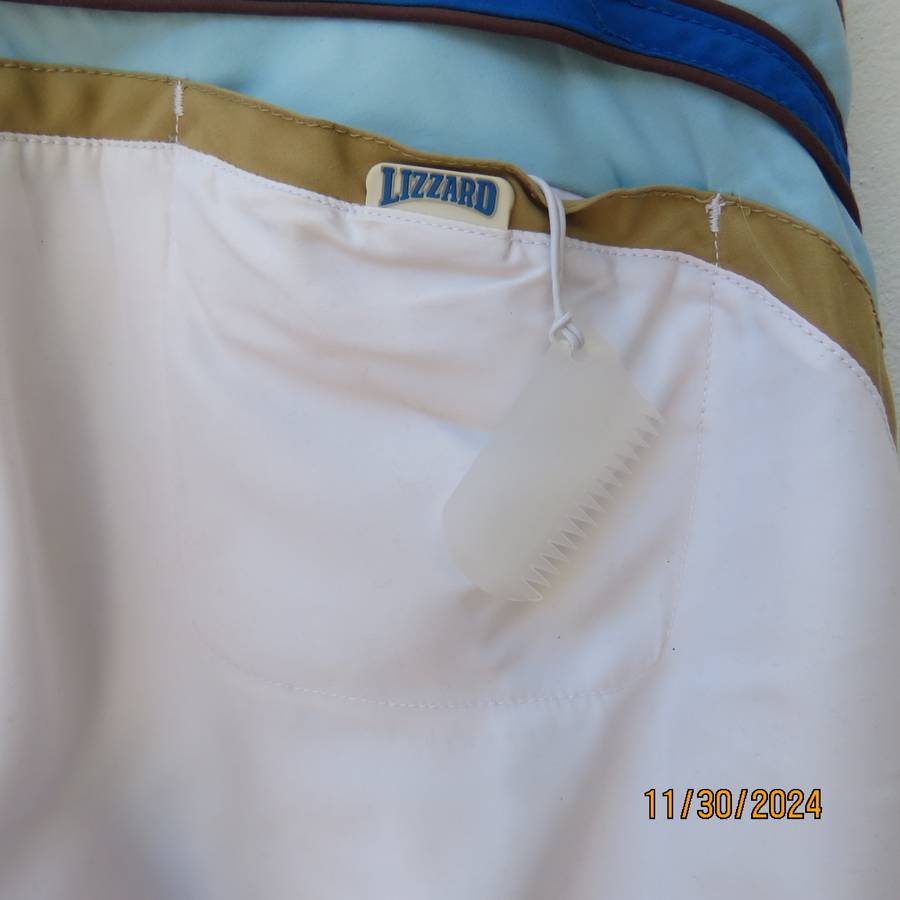 LIZZARD, as new men's white boardshorts. Golden brown-blue logo and stripes.Size 34 Breathing fabric