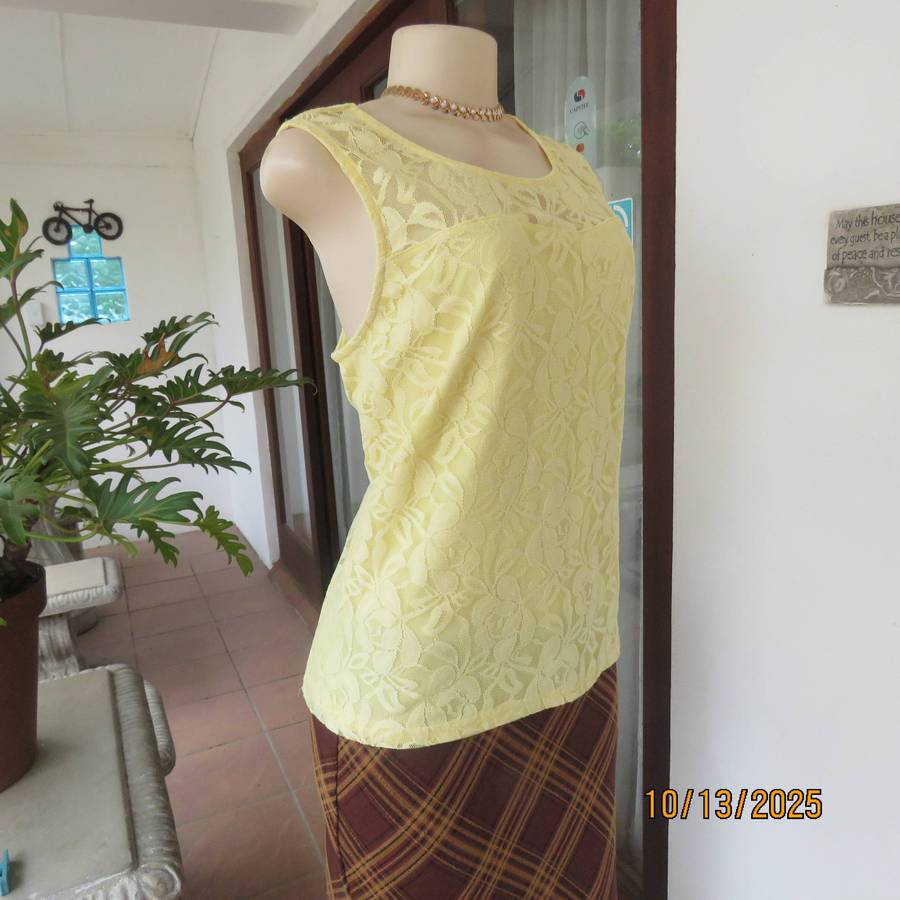 Lemon yellow stretch lace polyester partly lined sleeveless top. Size 44