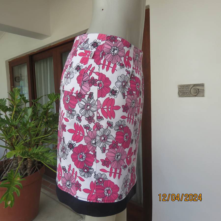 High quality heavy stretch white cotton-pink floral skirt. Size 36 by ARC Sportswear.With shorts.