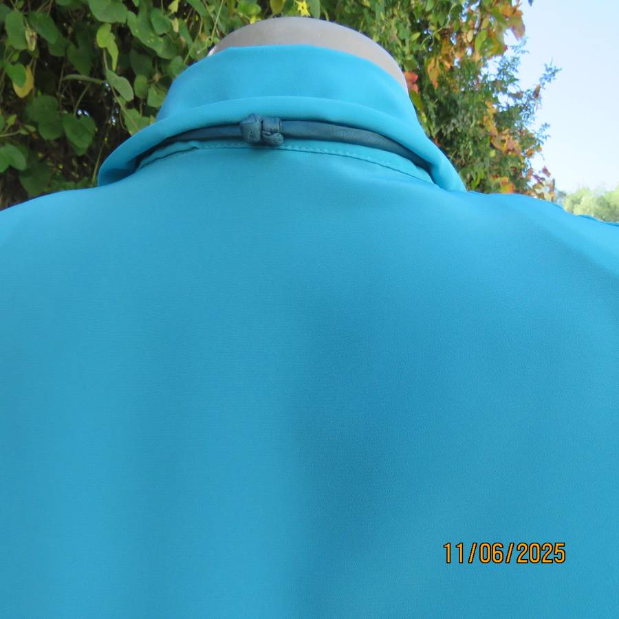 TOGETHER light turquoise short sleeve silky polyester open v collar top. Size 40.