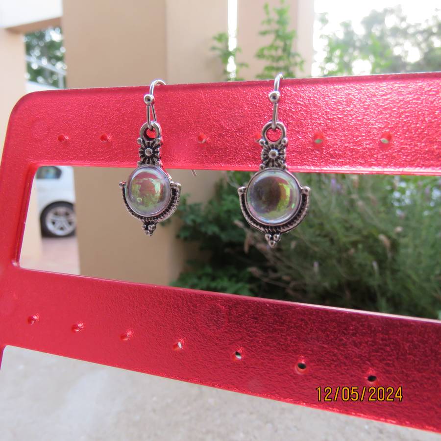 Cute silvery earrings with faux opal stones. Very pretty. New item