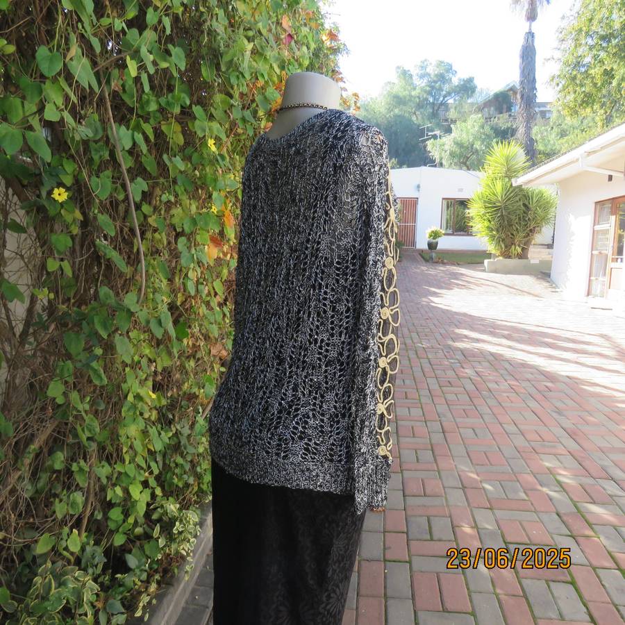 Black- silver -tiny sequins loose acrylic knit evening long sleeve top. Gold cord decor. Size 38