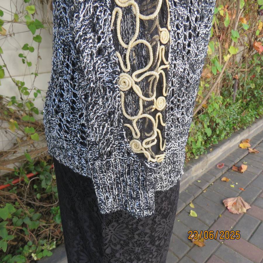 Black- silver -tiny sequins loose acrylic knit evening long sleeve top. Gold cord decor. Size 38