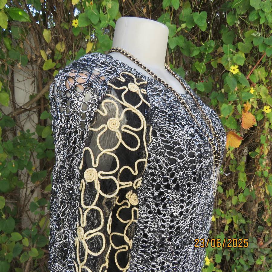 Black- silver -tiny sequins loose acrylic knit evening long sleeve top. Gold cord decor. Size 38