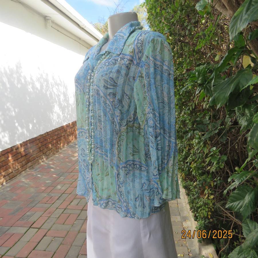 Soft blue-green permanent pleated paisley printed polyester top. Size 38.