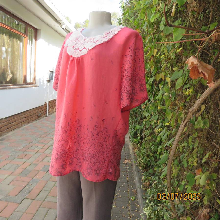Crimson slip over size 42 short sleeve top with dull black print. 100% Rayon.