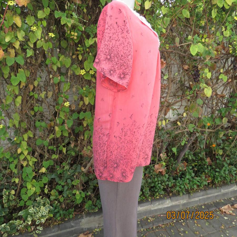 Crimson slip over size 42 short sleeve top with dull black print. 100% Rayon.