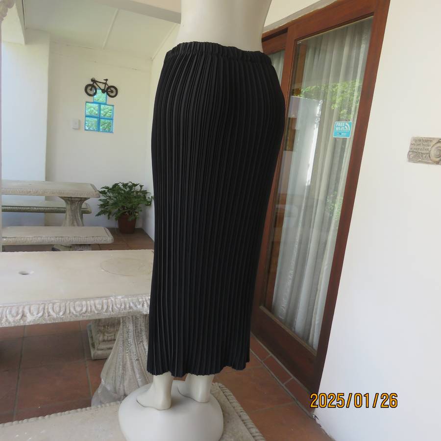 CHARISMA black fine permanent pleated polyester skirt size 36 with elasticated waist. Ankle length