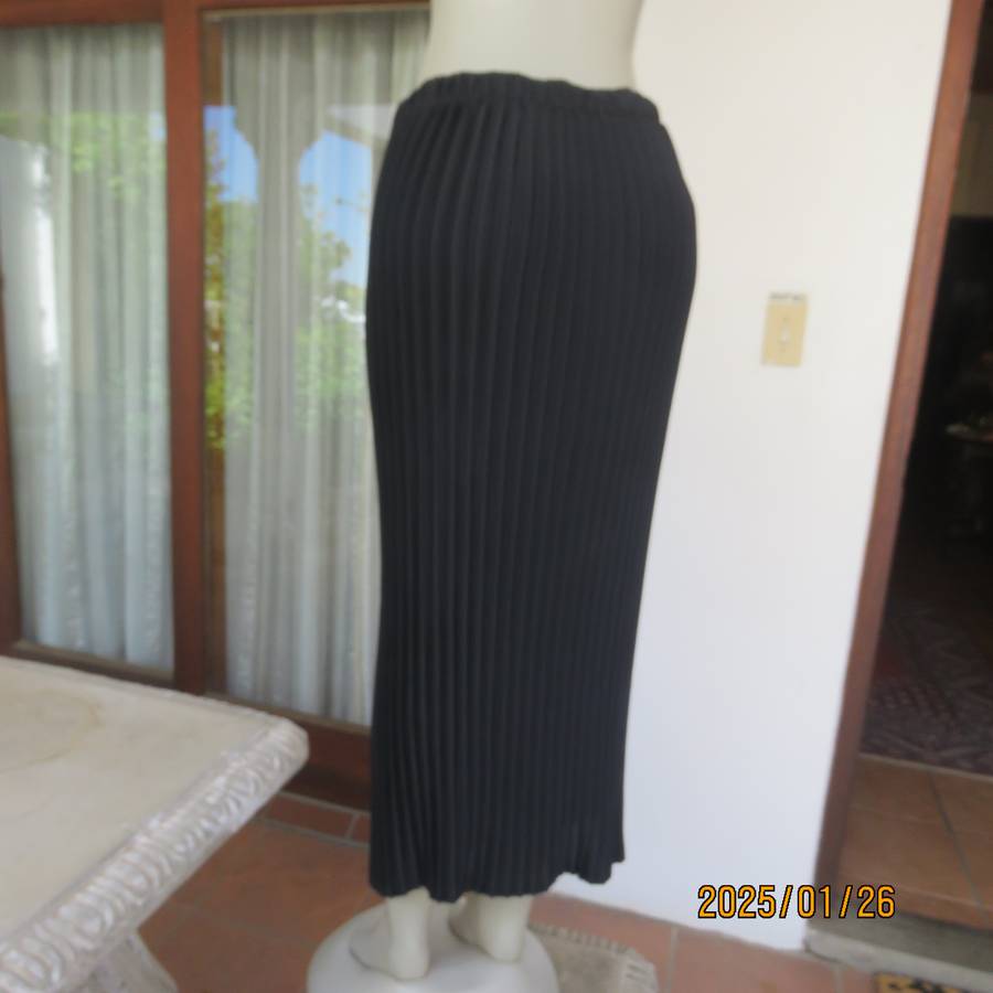 CHARISMA black fine permanent pleated polyester skirt size 36 with elasticated waist. Ankle length