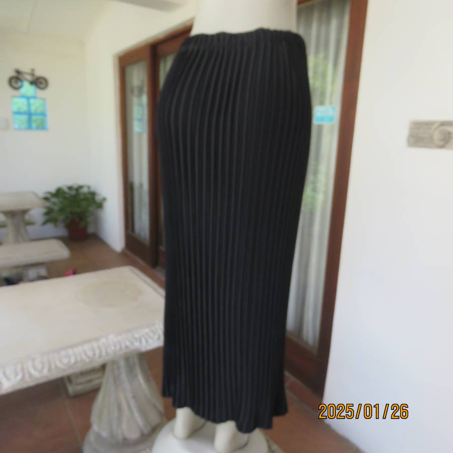 CHARISMA black fine permanent pleated polyester skirt size 36 with elasticated waist. Ankle length