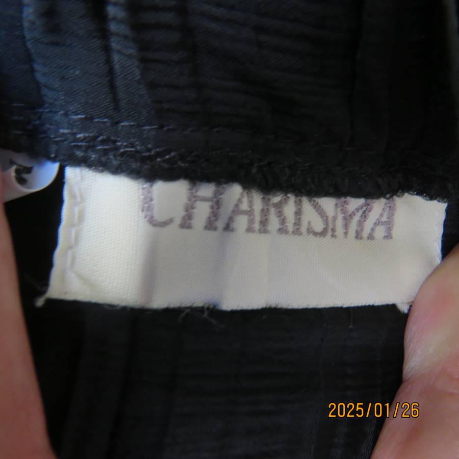 CHARISMA black fine permanent pleated polyester skirt size 36 with elasticated waist. Ankle length