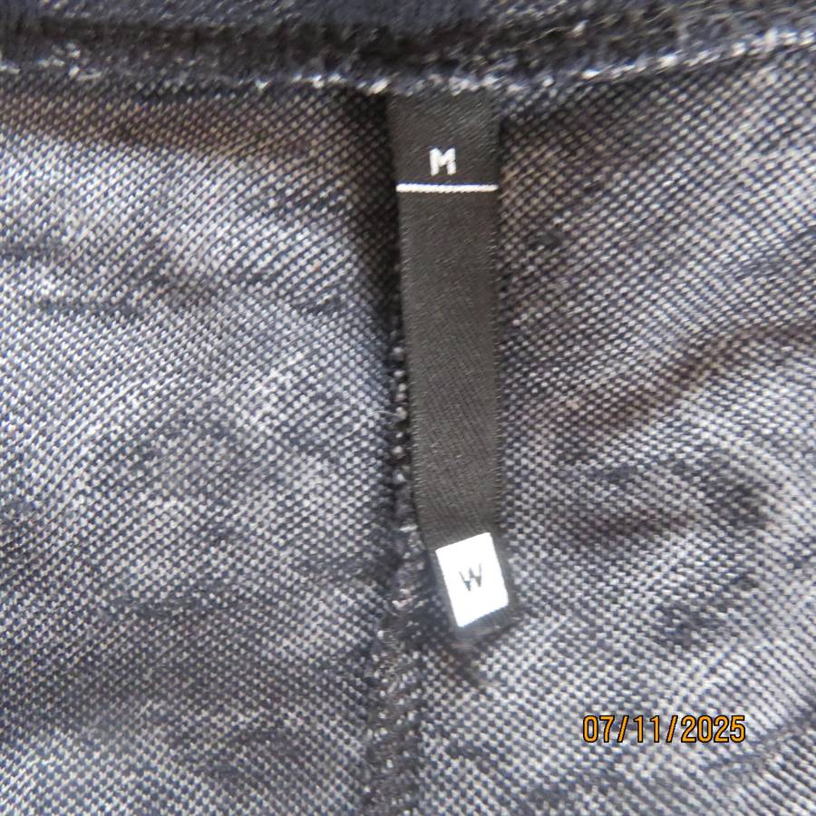 WOOLWORTHS grey-white mottled slip over top with black embossed designs. Size 40