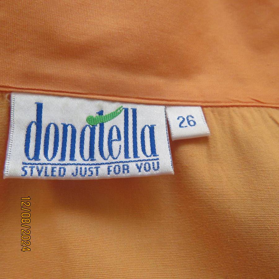 Easy to wear papaya colour button down top with gathered empire front. Size 50by DONATELLA. As new