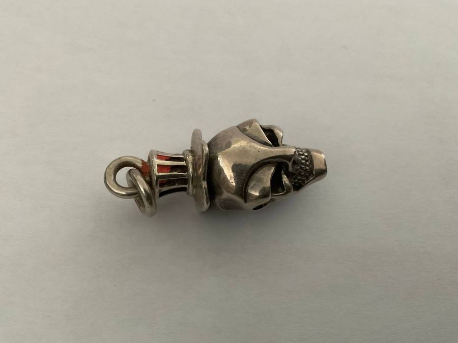 A sterling silver skull pendant