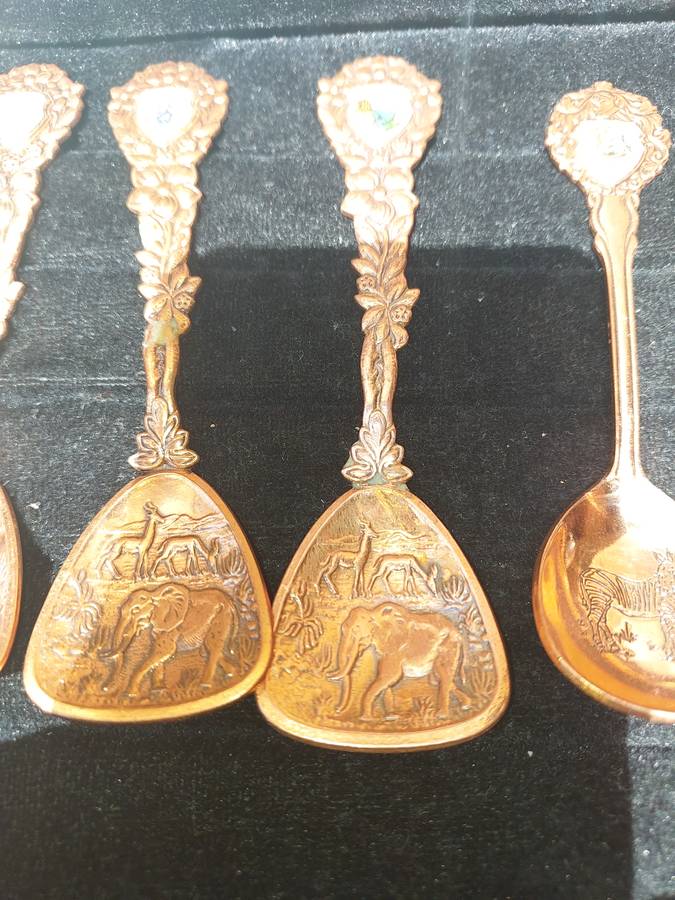 Copper African game animal memorabilia spoons - set of 11
