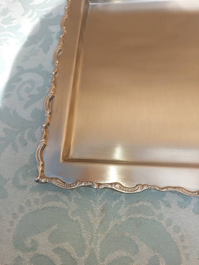 A SQUARE STAINLESS STEEL SERVING TRAY