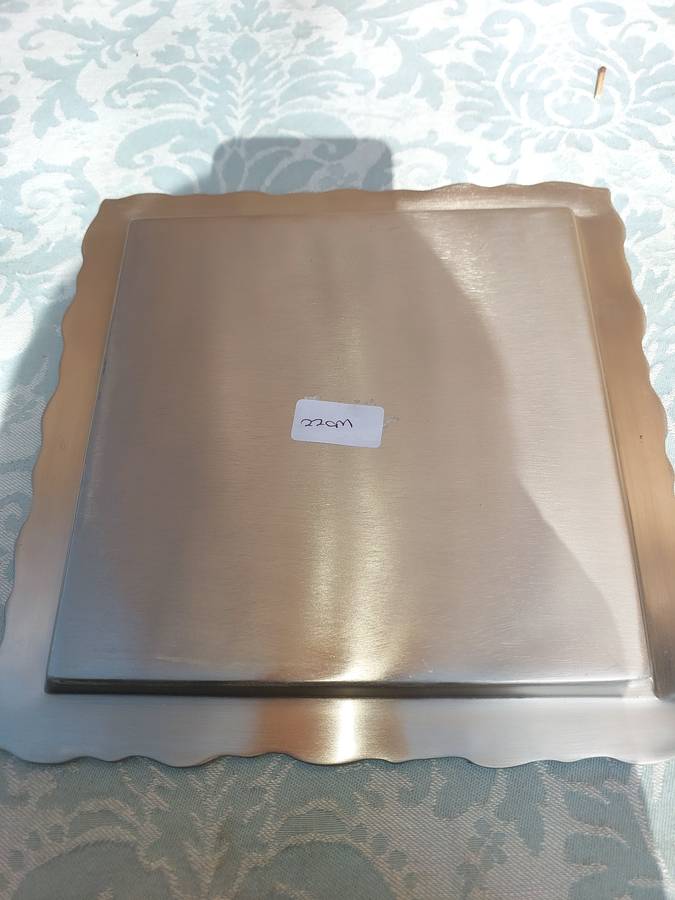 A SQUARE STAINLESS STEEL SERVING TRAY