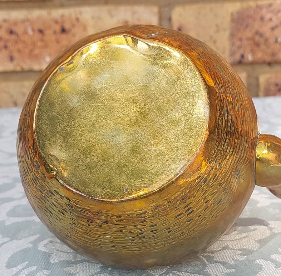 A VINTAGE BRASS TEAPOT SOLD AS IS