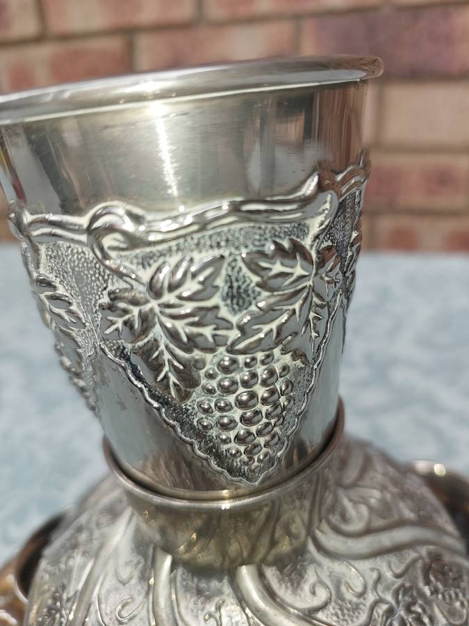 A VINTAGE KIDDUSH SET WITH 2 CUPS MISSING SOLD AS IS