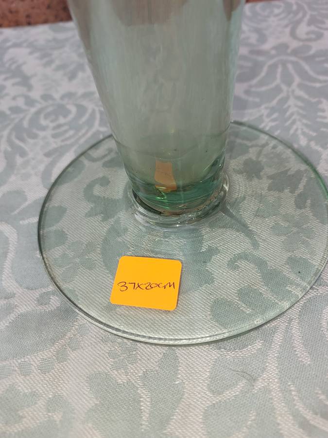 AN ART DECOR GREEN TINTED GLASS VASE SOLD AS IS