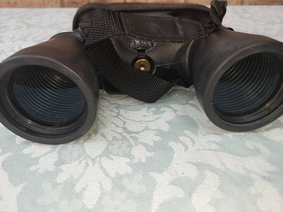 A USED PENTAX 10X50  6.5 XCF BINOCULARS SOLD AS IS
