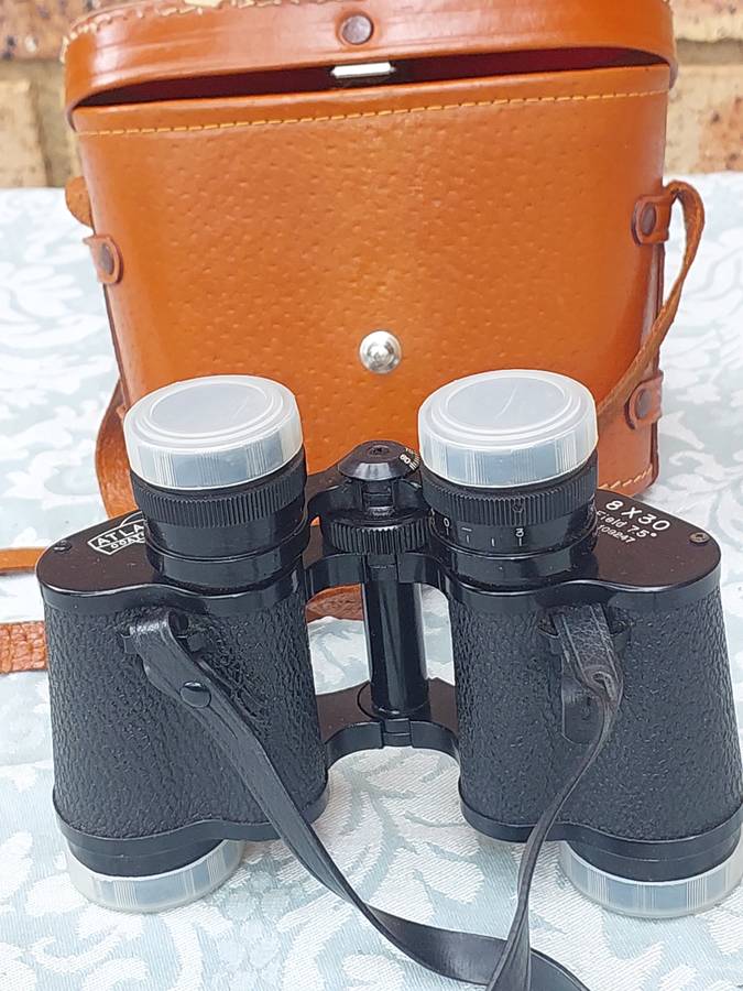 A VINTAGE ATLAS 8X30MM BINOCULARS SOLD AS IS