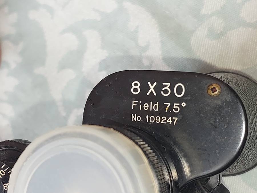 A VINTAGE ATLAS 8X30MM BINOCULARS SOLD AS IS