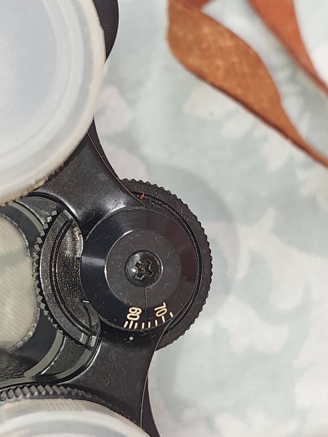 A VINTAGE ATLAS 8X30MM BINOCULARS SOLD AS IS