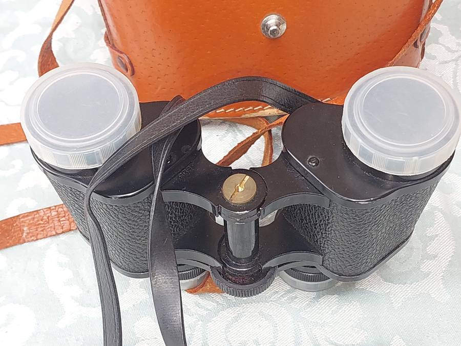 A VINTAGE ATLAS 8X30MM BINOCULARS SOLD AS IS